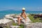 Portrait of a teenager in swimming trunks on the beach.