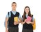 Portrait of teenagers in school uniform with books and backpacks on white