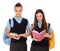 Portrait of teenagers in school uniform with books and backpacks on white