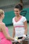 Portrait tennis couple speaking outdoors