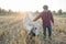 Portrait of Thai cowboy and cows in a field