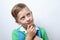 Portrait of thinker schoolboy with blue backpack on a white back