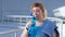 Portrait of thirsty female runner drinking water