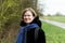 Portrait of a thirty year old beautiful woman with glasses at the Belgian countryside