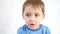 Portrait of a thoughtful child, on a white background