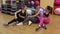 Portrait of three beautiful athletic girls in the gym.