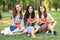 Portrait of three beautiful girls with slices of watermelon outdoors