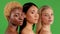 Portrait of three cheerful multinational young women with attractive appearance and different flawless skin tone and