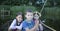 Portrait of three children fishing in a boat