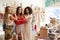 Portrait Of Three Female Sales Assistants Working In Clothing And Gift Store