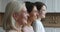 Portrait of three generational women family posing indoors