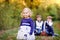 Portrait of three siblings children. Little cute toddler sister girl and Two kids brothers boys on background having fun