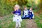 Portrait of three siblings children. Little cute toddler sister girl and Two kids brothers boys on background having fun