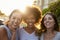 Portrait of three young adult female friends in the street