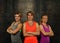 Portrait of three young athletic women in gym