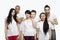 Portrait three young couples standing together over white background