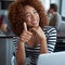 Portrait, thumbs up and black woman with laptop in office, workspace or working in creative career. Female person