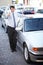 Portrait, thumbs up and a man at the dealership for a car sale, lease or rental in a commercial parking lot. Smile