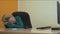 Portrait tired business woman yawning and sleeping at table in workplace