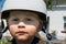 Portrait of toddler with helmet bike