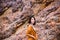 Portrait of traveler asian woman standing near cliff and looking camera at outdoor,Happy and smiling