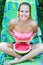 Portrait of a trendy young woman holding watermelon slice