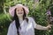 Portrait of trisomy adult outside having fun with flowers