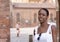 Portrait of turist woman dressed in white getting to know Europe, Ferrara. Italy