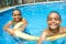 Portrait of twin brother boy having good time in swimming pool