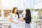 Portrait of two asian woman friend waiking and talking together in the city