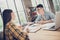 Portrait of two attractive cheerful people preparing lesson task home work at library loft industrial interior indoors