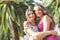 Portrait of two beautiful girls at park