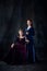 Portrait of two beautiful women in image of royal persons, queen and princess, isolated over dark background
