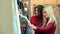 Portrait of two beautiful young women shopping in a clothes shop.