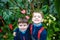 Portrait of two boys, siblings, brothers and best friends smiling. Friends hugging.