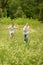 Portrait of two brothers running in nature