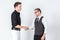 Portrait of two businessmen shaking hands business dealing successful concept