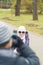 Portrait of two children in park photographing