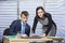 Portrait of a two colleagues signing documents