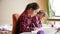 Portrait of two concentrated girls doing homework at room