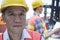 Portrait of two engineers in protective workwear working, looking at camera, outside in a shipping yard