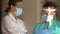 Portrait of two female doctors in protective masks. Two colleagues consult before prescribing treatment for a patient