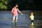 Portrait of two generation men fishing. Little boy fishing with father. Generations ages: father and son. Fishermen