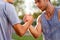 Portrait of two handsome strong men handshake. Focused on hands