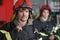 Portrait of two heroic fireman in protective suit