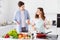 Portrait of two nice lovely attractive cheerful cheery spouses making domestic fresh homemade dish cookery culinary in