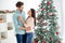 Portrait of two people romantic spouses with brunet hair hugging enjoy christnas time x-mas vacation wearing blue denim