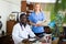 Portrait of two positive doctors of different nationalities, who are in the resident's office of the clinic