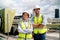 Portrait of two professional engineer or technician workers stand and look at camera with smiling and arm-crossed on terrace of