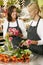 Portrait Of Two Sales Assistants In Florists Shop